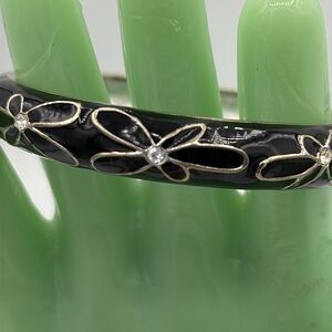 Glossy black enamel clamper bracelet with modernist flowers